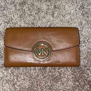 Michael Kors brown wallet.